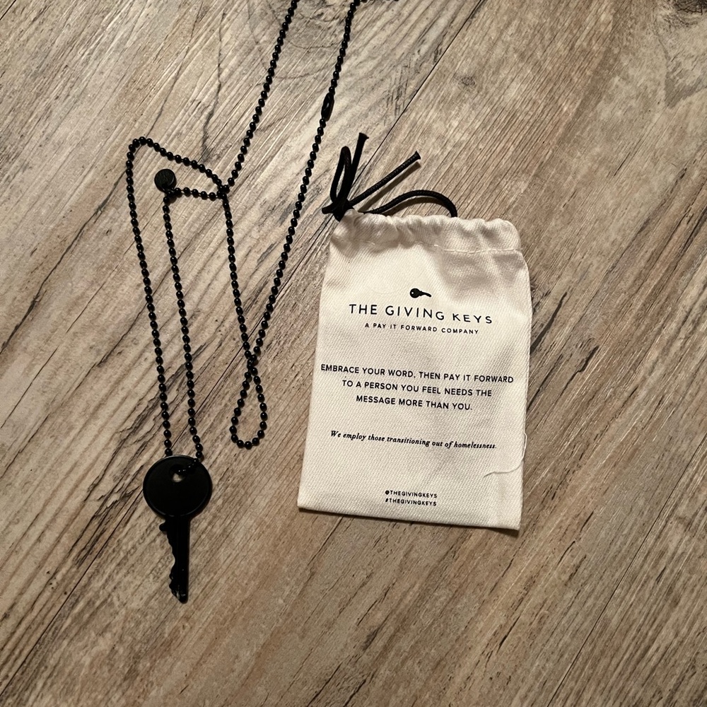 Matte Black Dainty Brooklyn Necklace giving keys